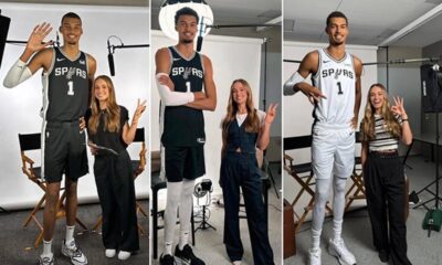 Victor Wembanyama in a Spurs uniform, showcasing his exceptional height and wingspan on the basketball court.