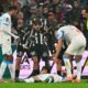 Marseille soccer player receiving medical attention on the pitch after collapsing during a match.
