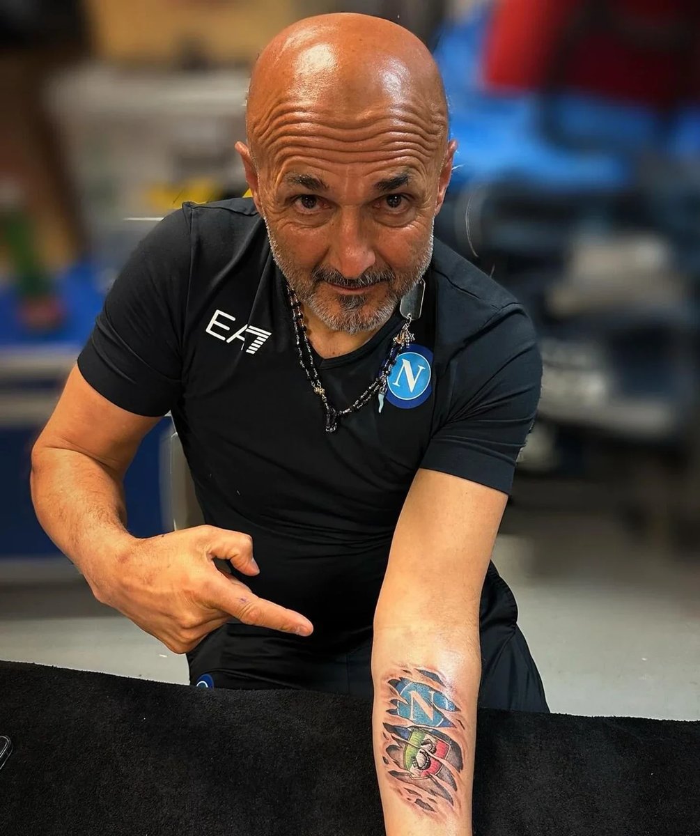 Luciano Spalletti showing his SSC Napoli tattoo while discussing his time coaching the Italian football club.