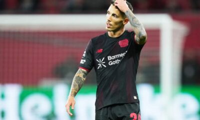 Xabi Alonso on the touchline managing Bayer Leverkusen during a Bundesliga match.