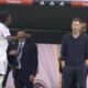 Real Madrid's Vinicius Jr shouting in frustration during a match on the sideline after a refereeing decision.