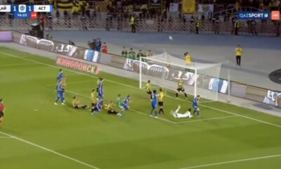 Kairat players celebrating with the Kazakh Premier League trophy after winning the championship title.