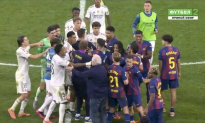 Dani Carvajal celebrates Real Madrid's El Clásico win, playfully trolling Barcelona's Lamine Yamal on the pitch.