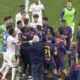 Dani Carvajal celebrates Real Madrid's El Clásico win, playfully trolling Barcelona's Lamine Yamal on the pitch.