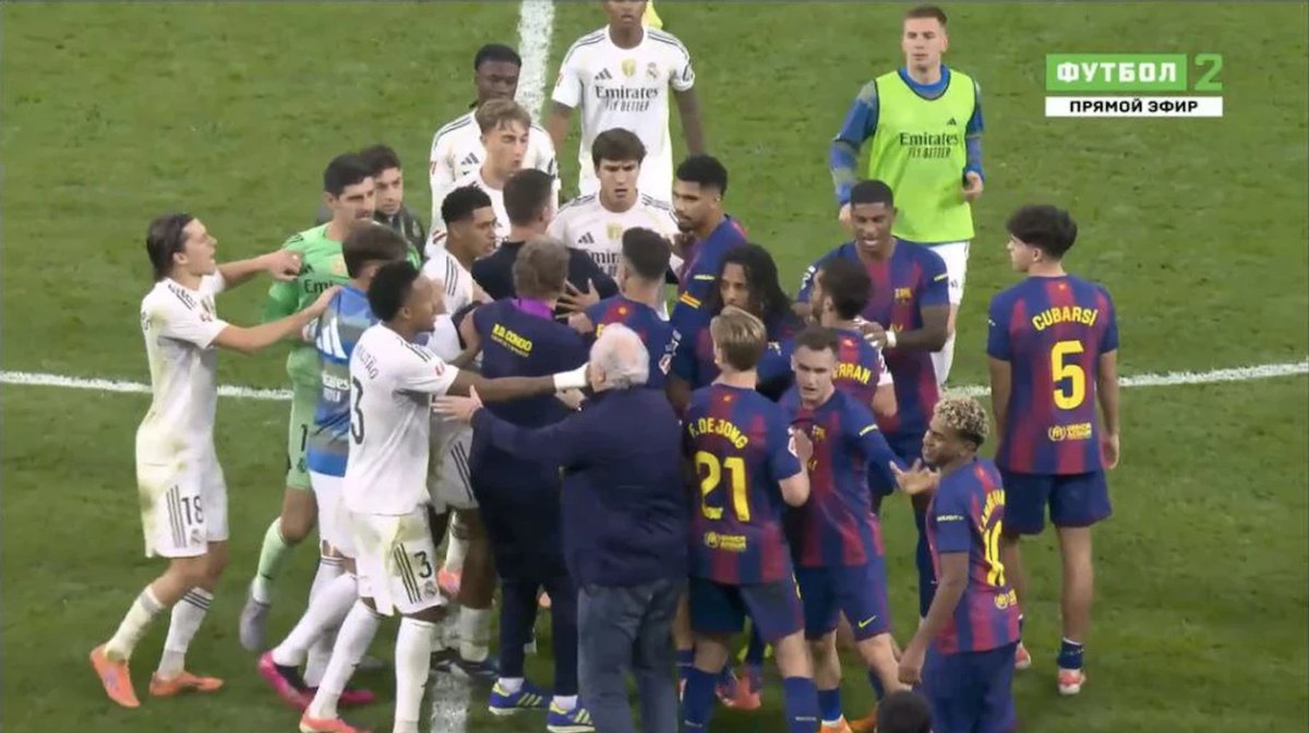 Dani Carvajal celebrates Real Madrid's El Clásico win, playfully trolling Barcelona's Lamine Yamal on the pitch.