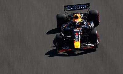 Max Verstappen's Red Bull F1 car leads Lando Norris' McLaren at the Mexico Grand Prix.