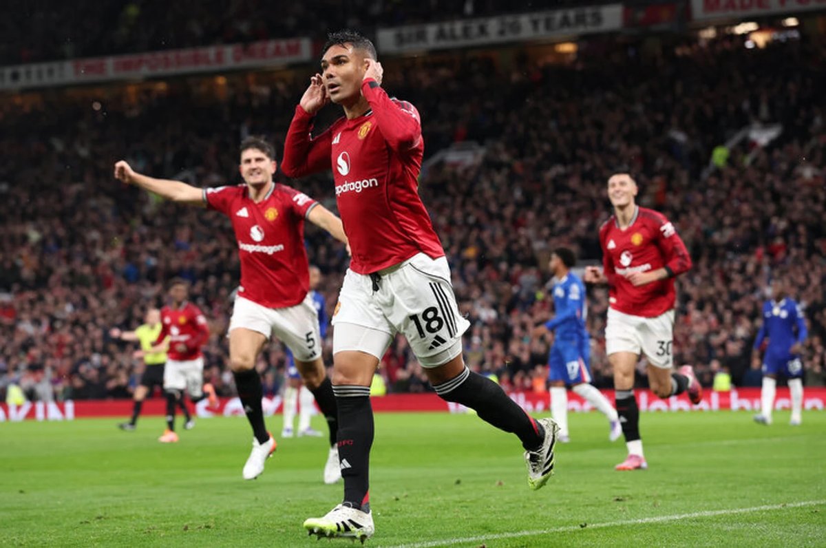 Casemiro celebrating a goal for Manchester United under new manager Ruben Amorim, looking revitalized on the pitch.