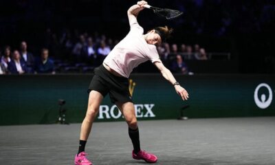 Alexander Bublik smashes his tennis racket on the court during his Paris Masters match against Felix Auger-Aliassime.