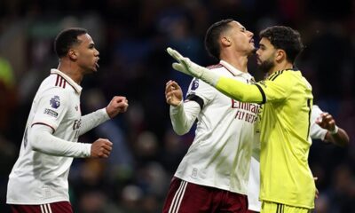 Arsenal players celebrating a goal, illustrating their 71% Premier League title chance and historic dominance.