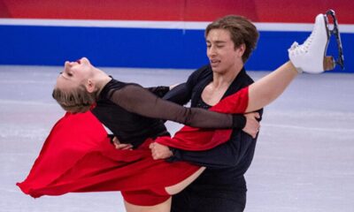 Figure skater performing a routine to AI-generated music, showcasing the fusion of technology and athletic artistry.