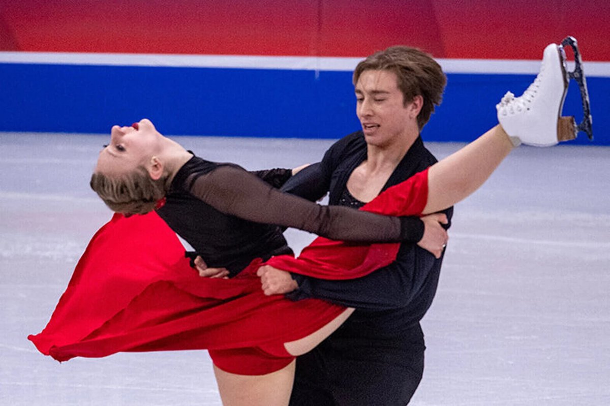 Figure skater performing a routine to AI-generated music, showcasing the fusion of technology and athletic artistry.