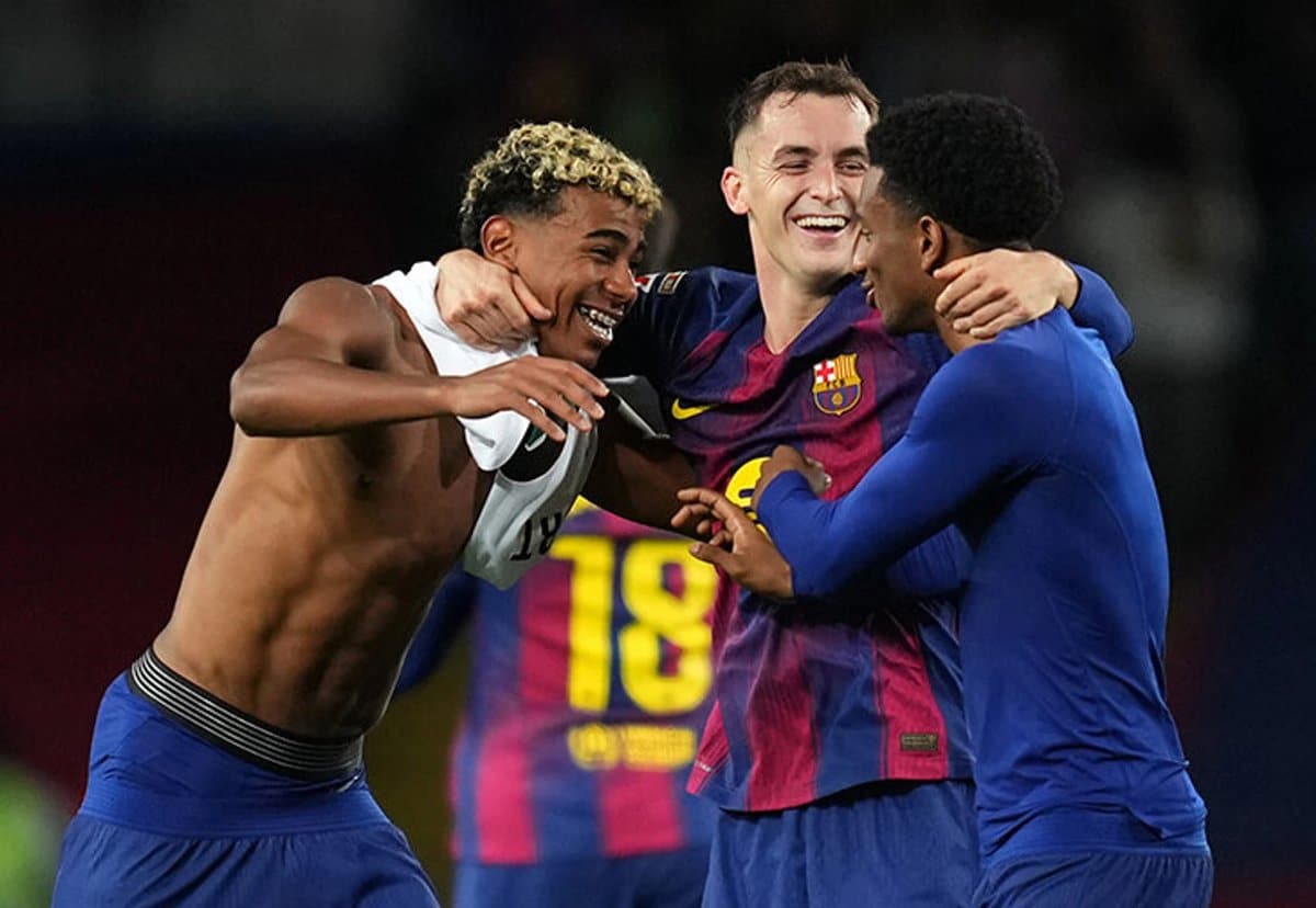 Barcelona players celebrating a goal against Elche after their El Clásico victory.