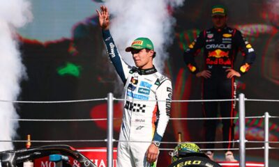 Lando Norris in his McLaren chasing Max Verstappen's Red Bull car during the final F1 championship race.