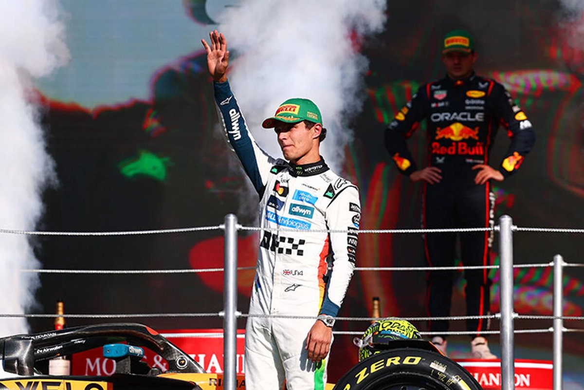 Lando Norris in his McLaren chasing Max Verstappen's Red Bull car during the final F1 championship race.