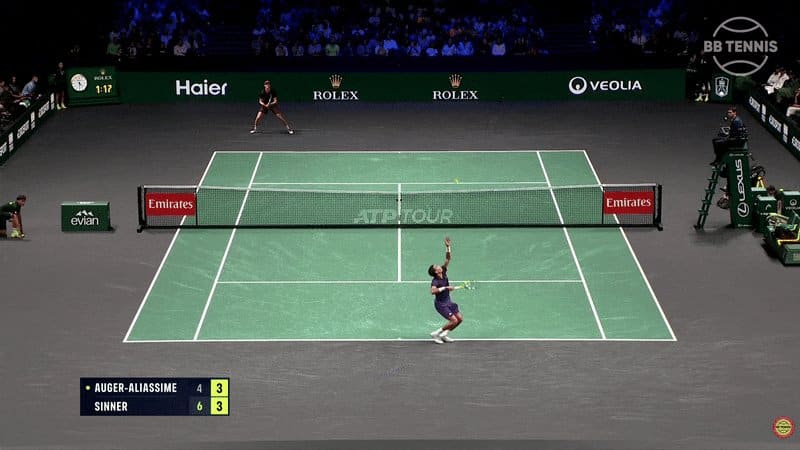 Jannik Sinner holding the Paris Masters trophy after winning to reclaim the ATP world No.1 ranking.